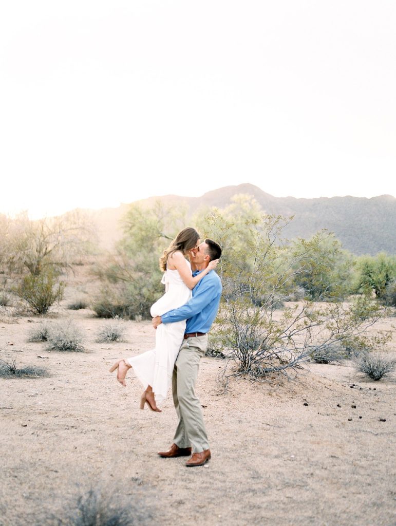 couple laughing in the desert 
