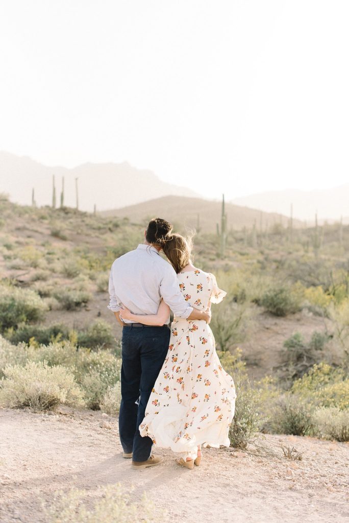 couple embracing in the desert sunset