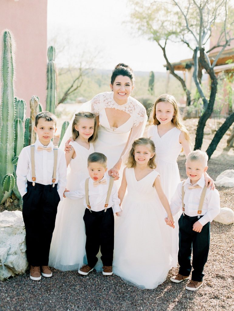 bride with her flower girls and ring bearers 