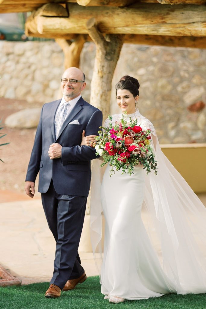 bride with father walking down the aisle 